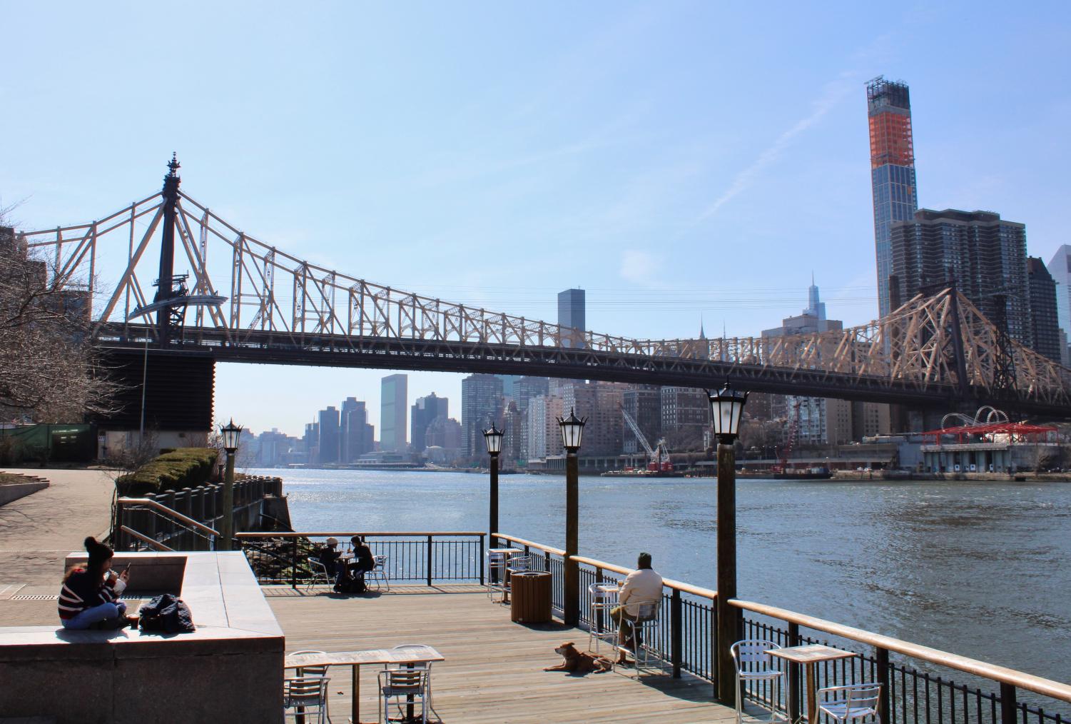 view of a bridge over water in spring