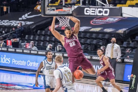 fordham player hanging off the rim of the basket during the game against george washington