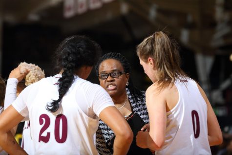 assistant coach Sonia Burke directs womens basketballplayers during a game