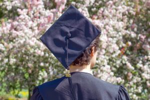 commencement celebration for student with cap and gown