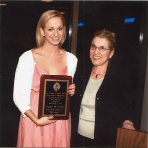 Elizabeth Stone pictured with Assistant News Editor Nancy Young at Senior Leadership Awards, with Young holding an award.
