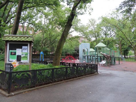 a playground in a park, featuring a Washington Bridge repplica
