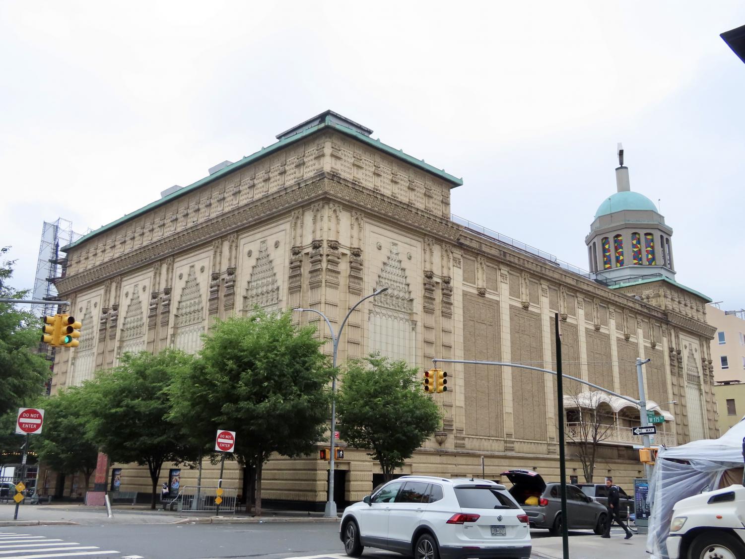 a large stone building with a colorful dome at the top