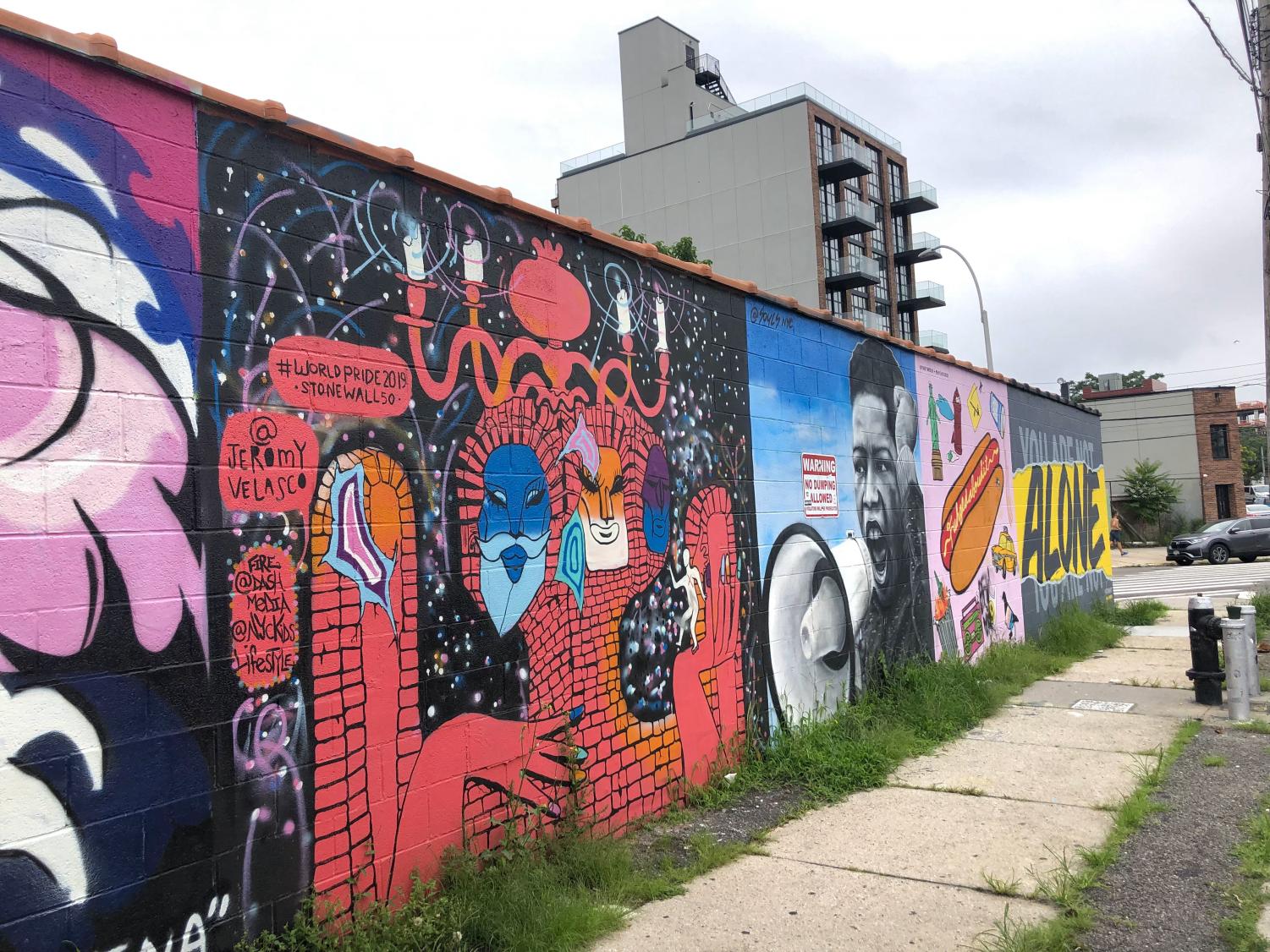 red and black street art on concrete, the Welling Court Mural Project