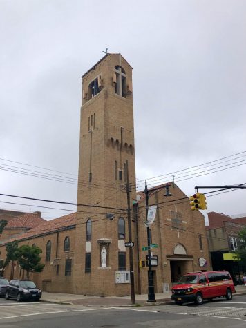 tall belltower of a Roman Catholic church in Astoria