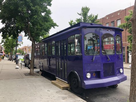 a purple trolley on Ditmars Boulevard