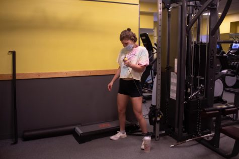 girl works out in the McMahon fitness center