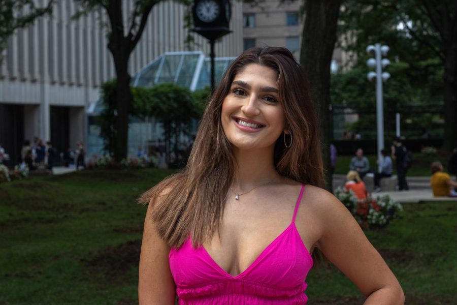 djellza pulatani stands at lincoln center smiling in a pink dress