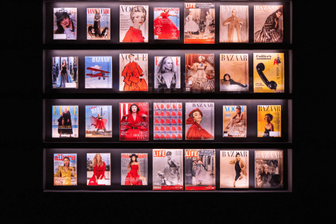 A wall of red, pink and yellow photographs