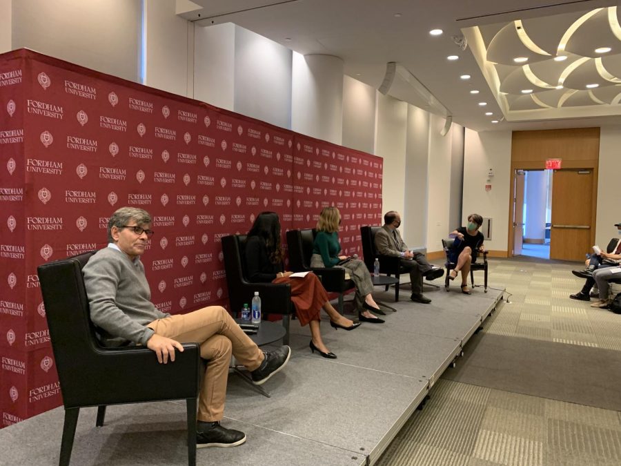 for a panel on political polarization, five speakers sit in front of an audience