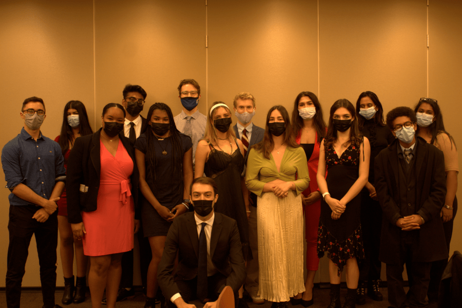 Usg vice president and president and other members stand for a photo in the gabelli building