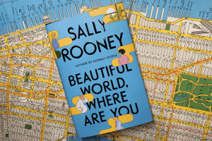 beautiful world where are you by sally rooney atop a map