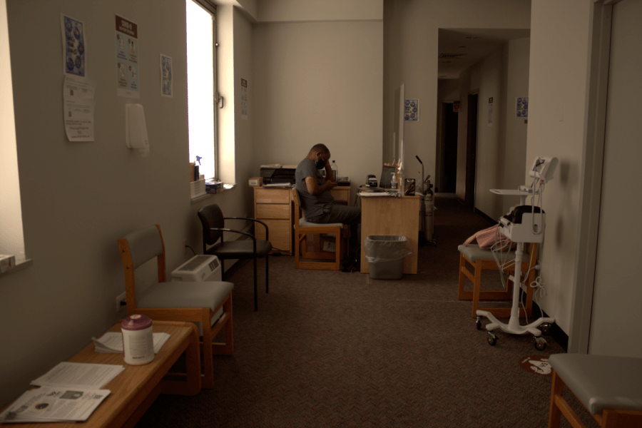 a worker sits at a desk in the McMahon center for tests