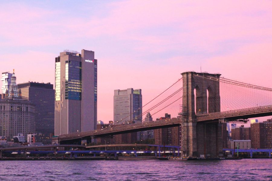 view of nyc and the brooklyn bridge at sunset
