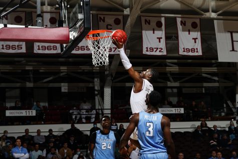 player makes a basket against columbia