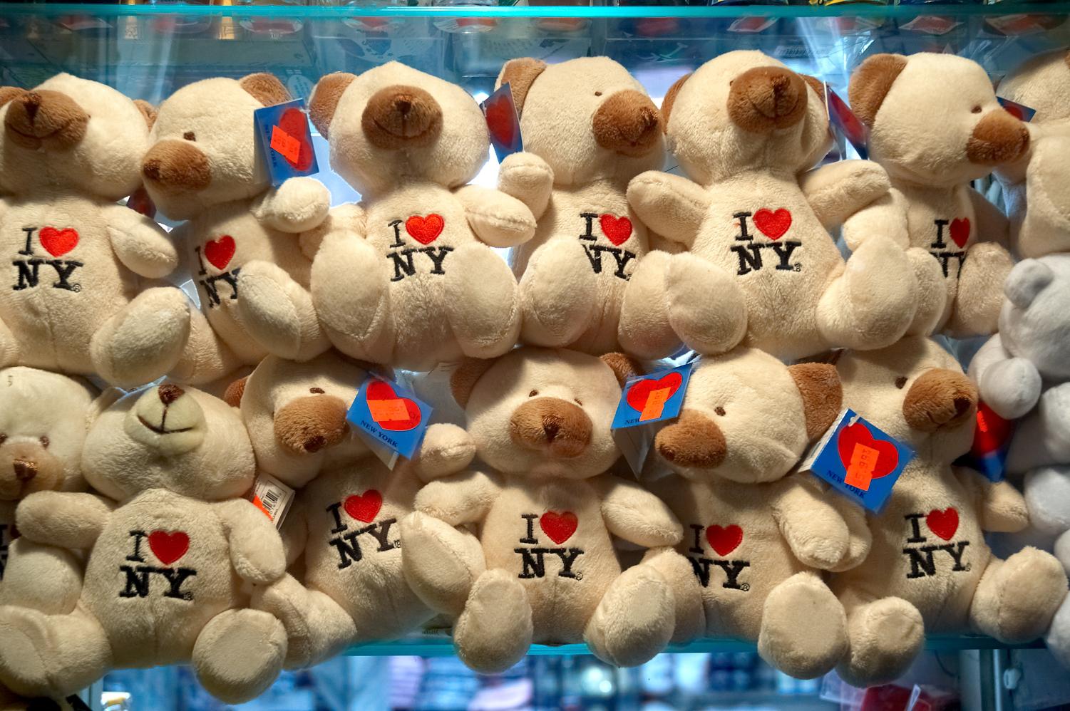 the i ny heart logo on a number of stuffed bears