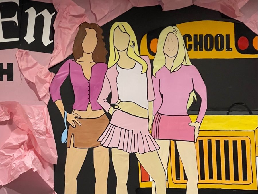 drawings of characters from Mean Girls, with a smiley face on one character drawn as an act of vandalism