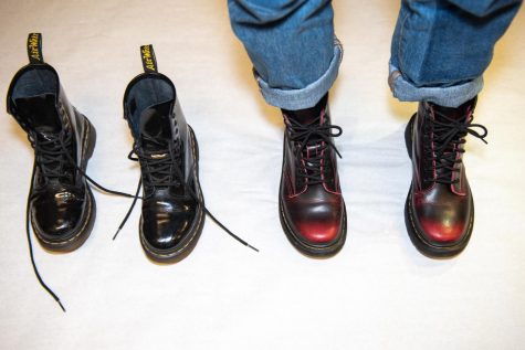 doc martens with one empty pair and one with feet in them