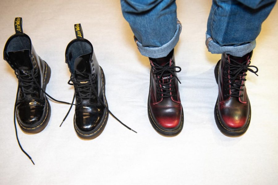 doc martens with one empty pair and one with feet in them