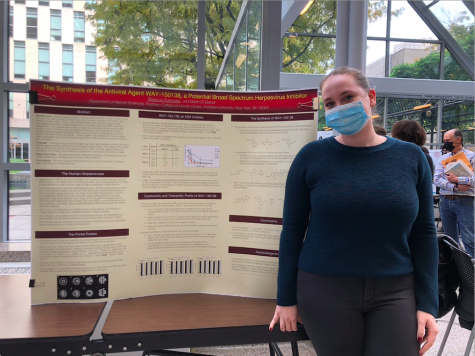 rebecca dubrovsky stands at research project symposium