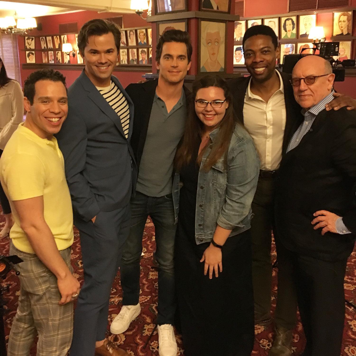 steward with the cast and writer of the boys in the band during a shoot for on stage