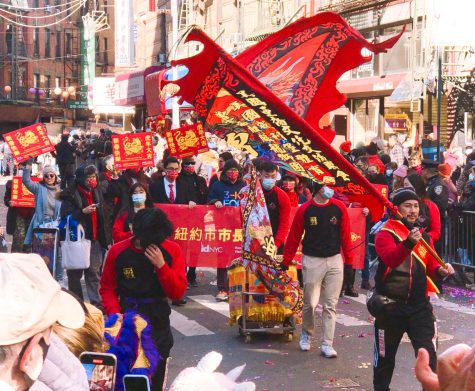 people holding signs with traditional chinese lettering for year of the tiger