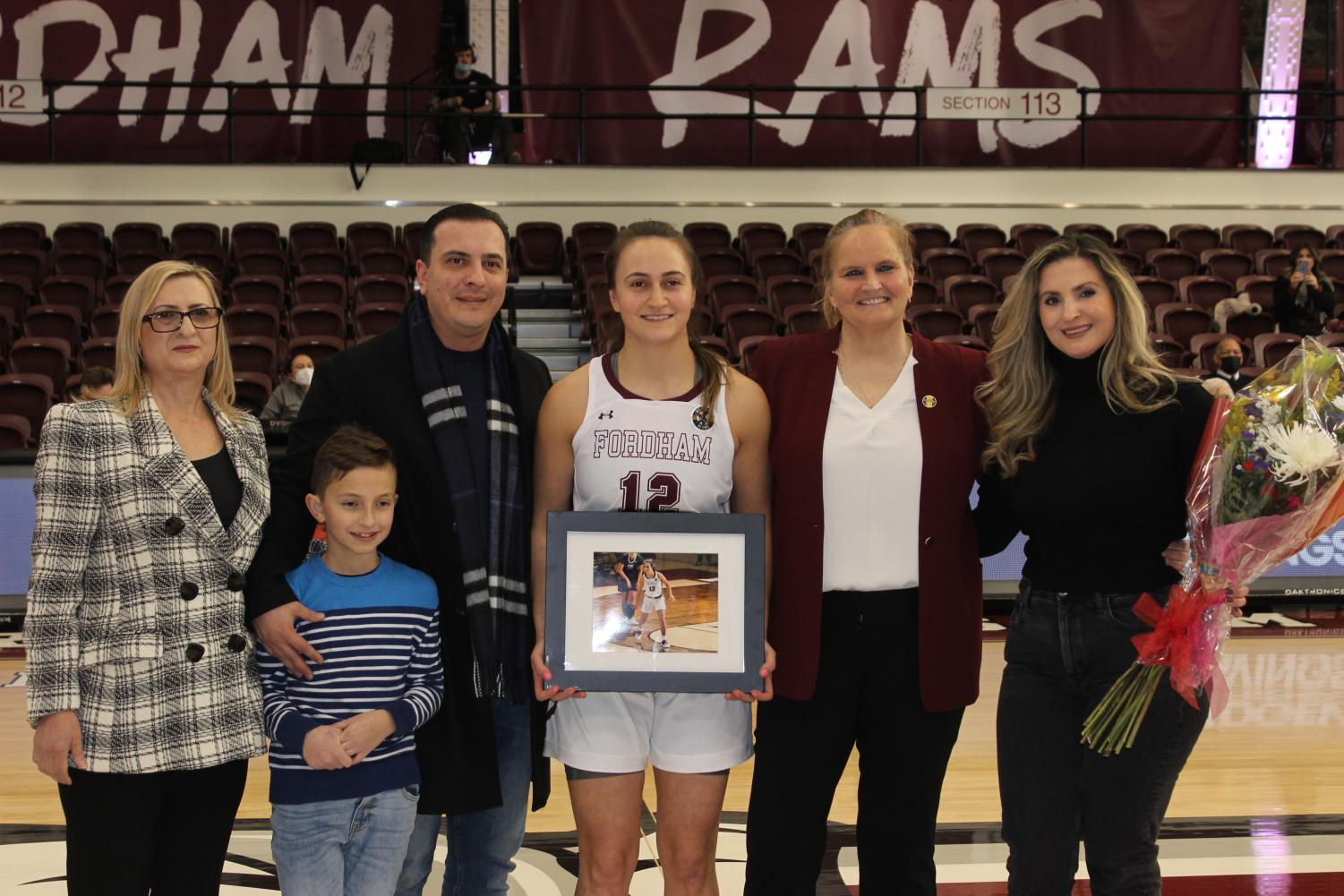 edona thaqi and family walk in the rose hill gym