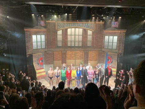 heathers cast on stage in london with colorful costumes