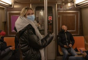 student riding the subway from mta