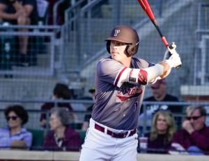 a fordham baseball player standing up to bat