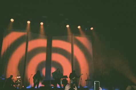 red and black circles on background at marina concert