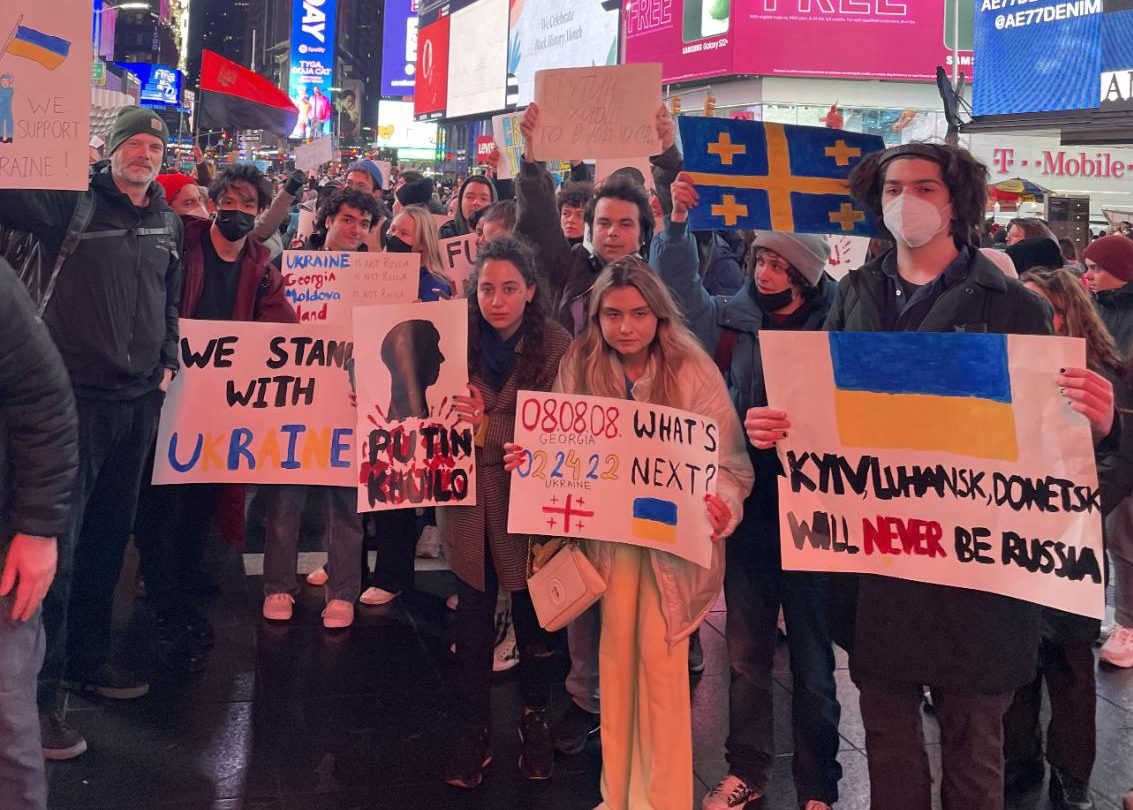 times square protest for ukraine with students with signs in support