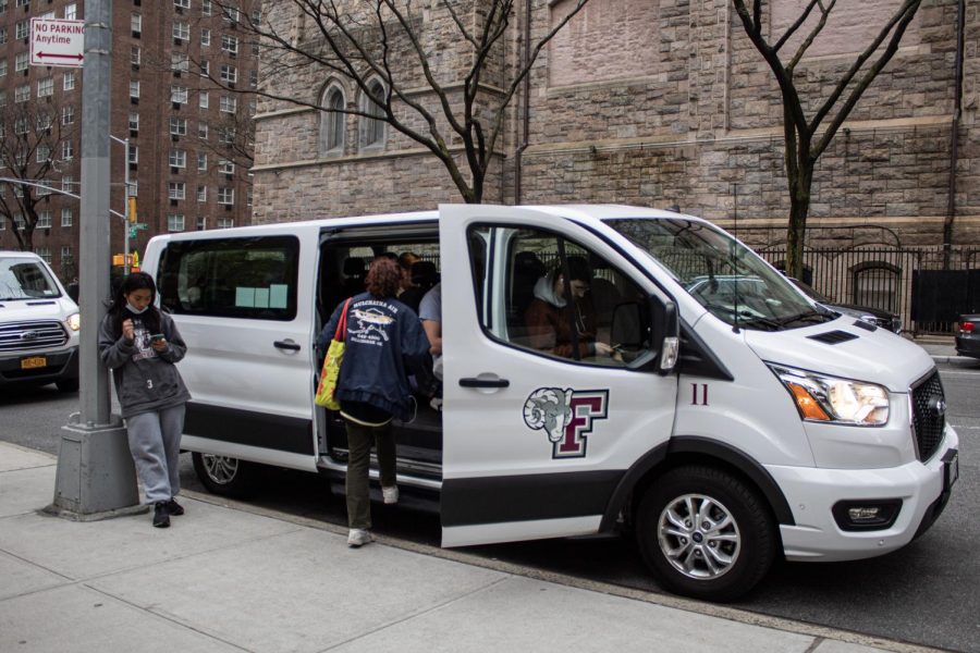 Students wait to board the Ram Van which makes 570 round trips each week between both campuses. 
