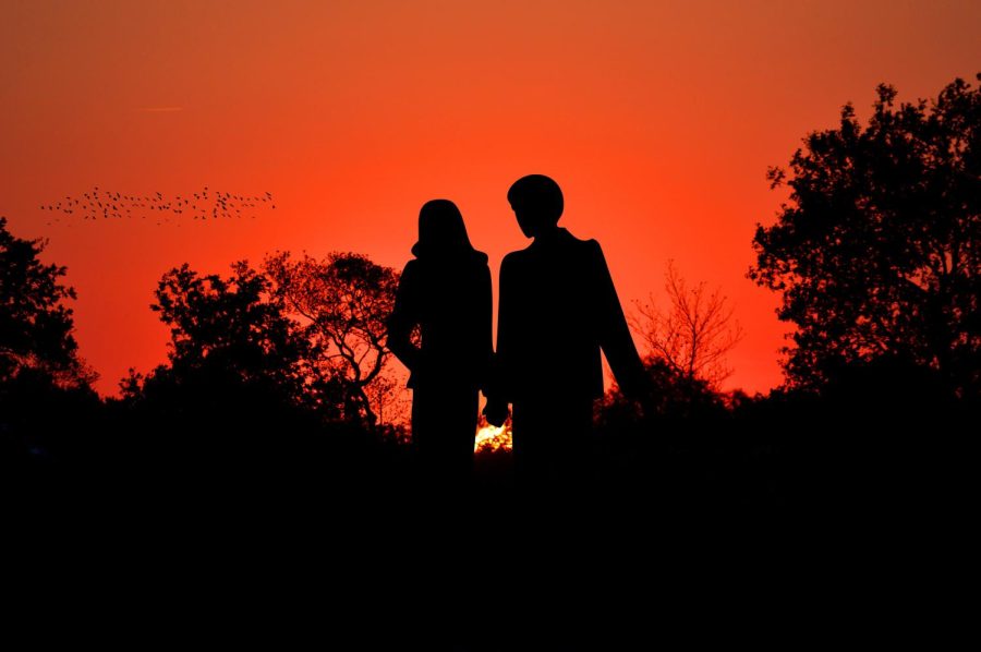 relationships photo two people red sunset background