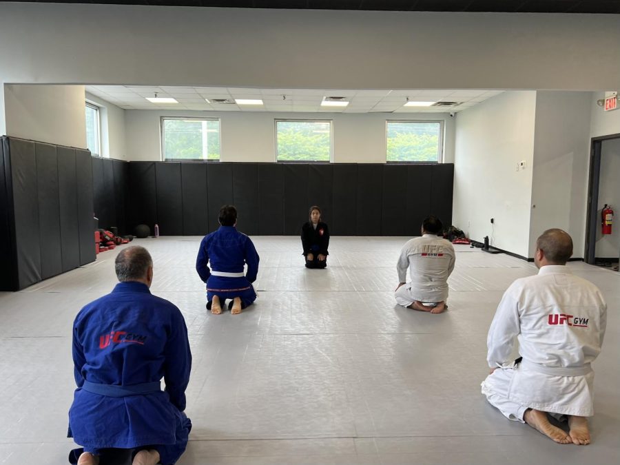 Coach Janecia Martinez leads a meditation before class at Bergen County Jiu-Jitsu.