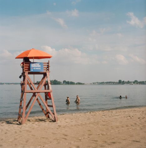 Bathers at Orchard Beach, despite the beach being contaminated with sewer waste.