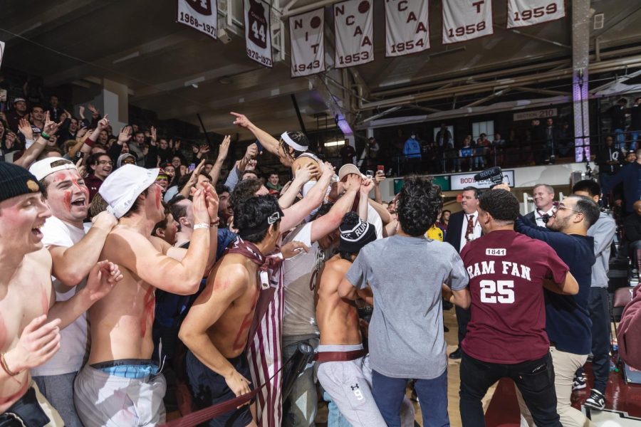 Darius Quisenberry, GSAS ’23, celebrates with the student section after posting 14 points in the victory.