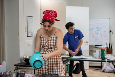 Alexa Smith, FCLC ‘25 (front), who plays Annie, stirs a bowl. 