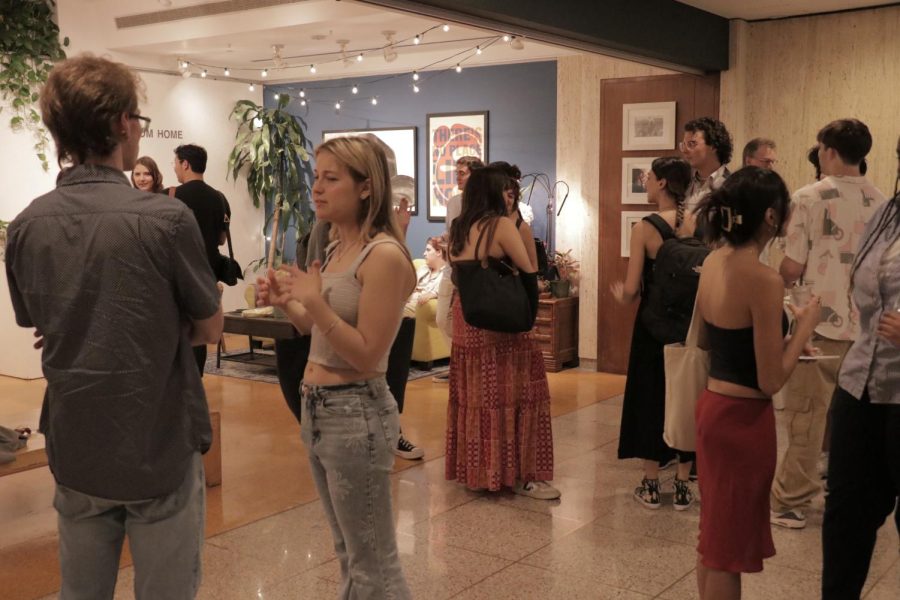 Fordham students and faculty mingle at the opening reception.