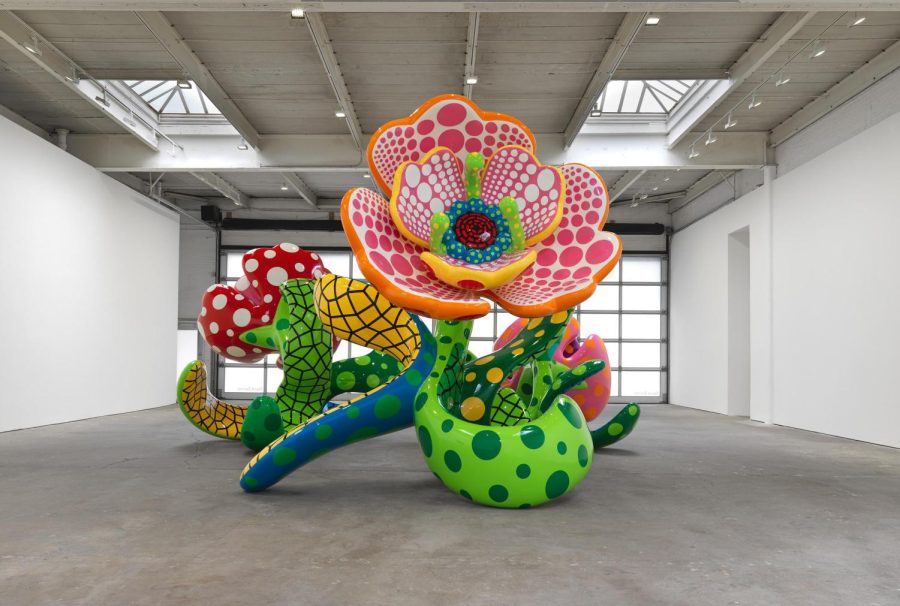 The large floral structures in "I Spend Each Day Embracing Flowers" speak to Kusama's beliefs that flowers, and nature, grant her life and youth.