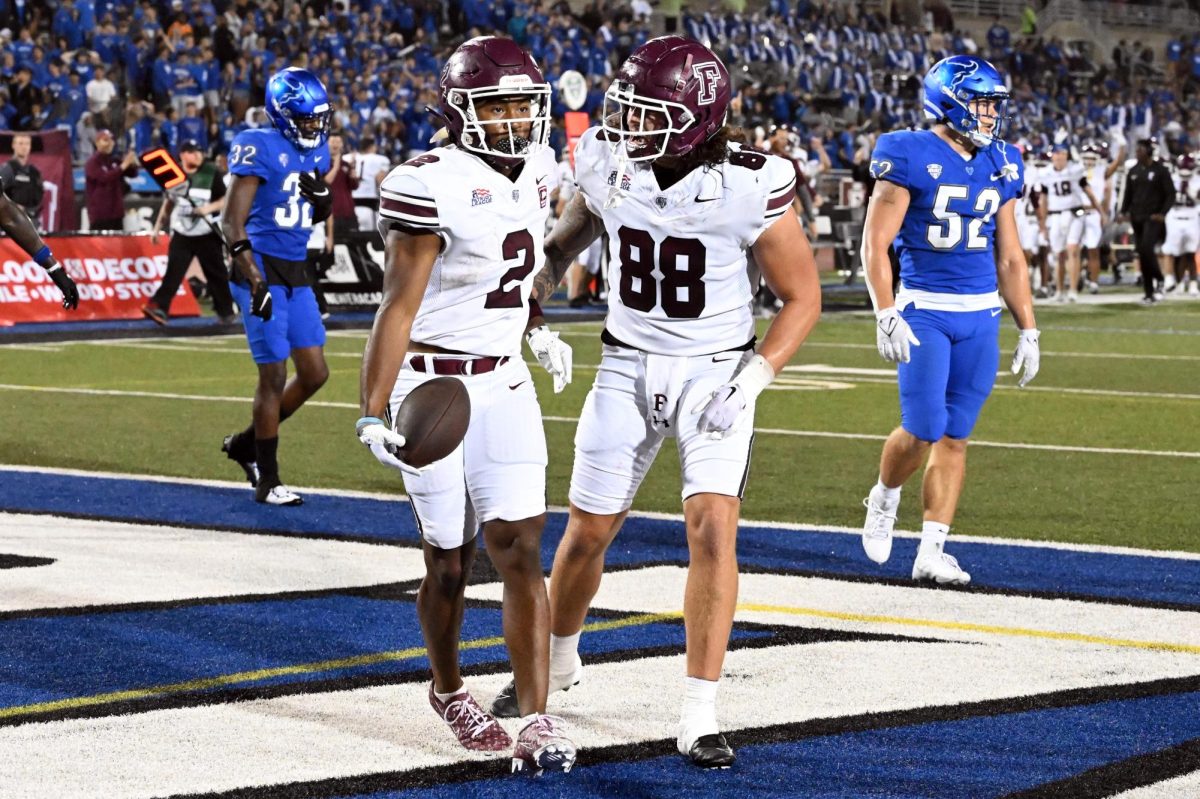 MJ Wright, GGSB ’25, and Jaden Allen, FCRH ’25, celebrate in the end zone after scoring the game-winning touchdown.