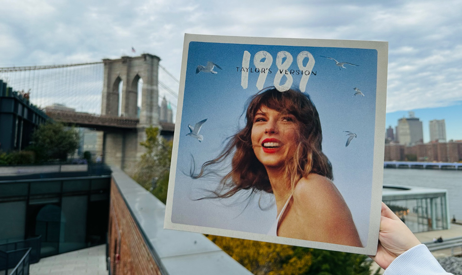Taylor Swifts 1989 album cover in Brooklyn. The album cover features Swift on a blue background. If youre reading this, comment your favorite song!