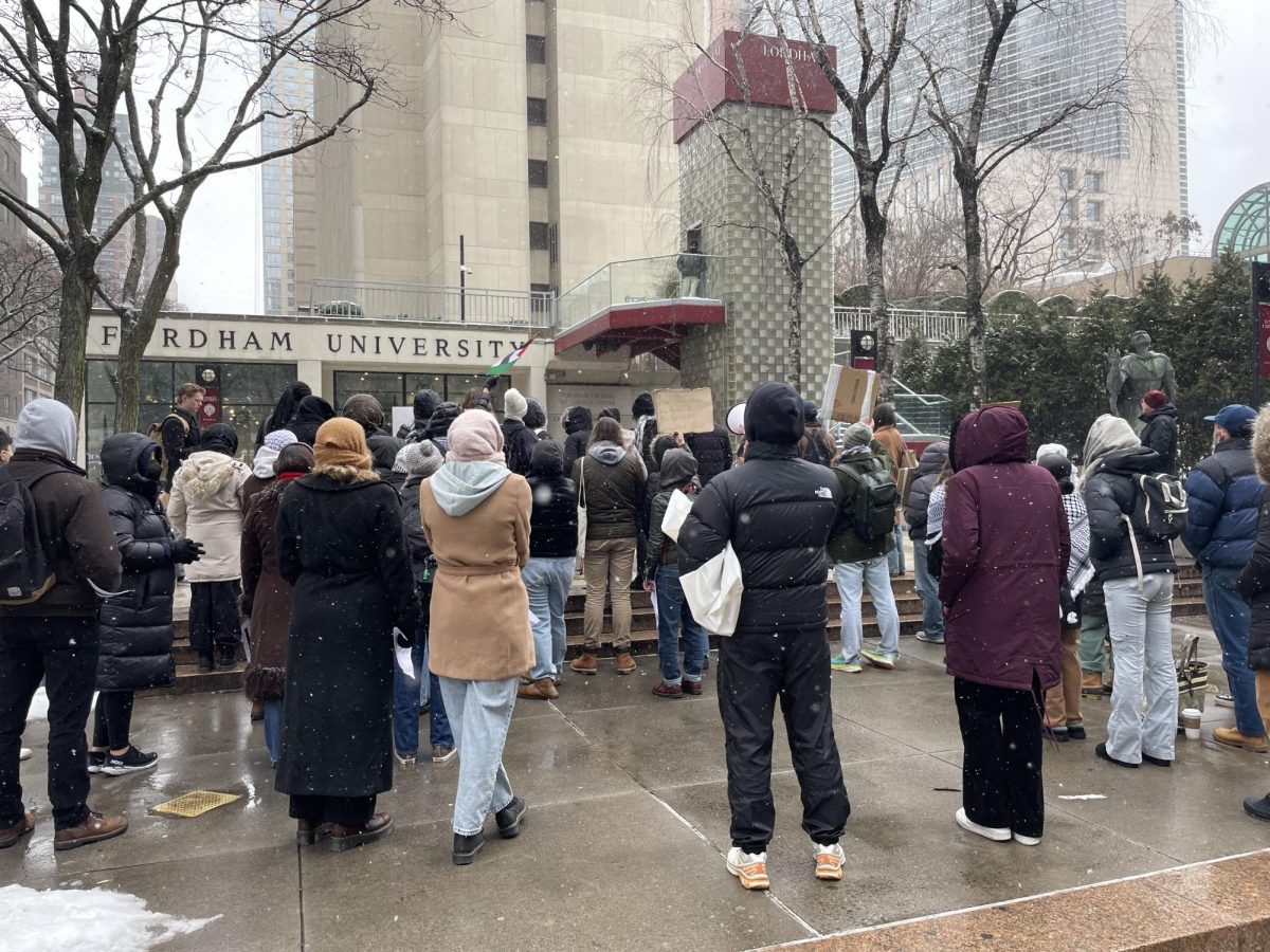 Members of the Fordham community congregated in front of the Leon Lowenstein entrance in protest of the university’s response to the Israel-Hamas war.