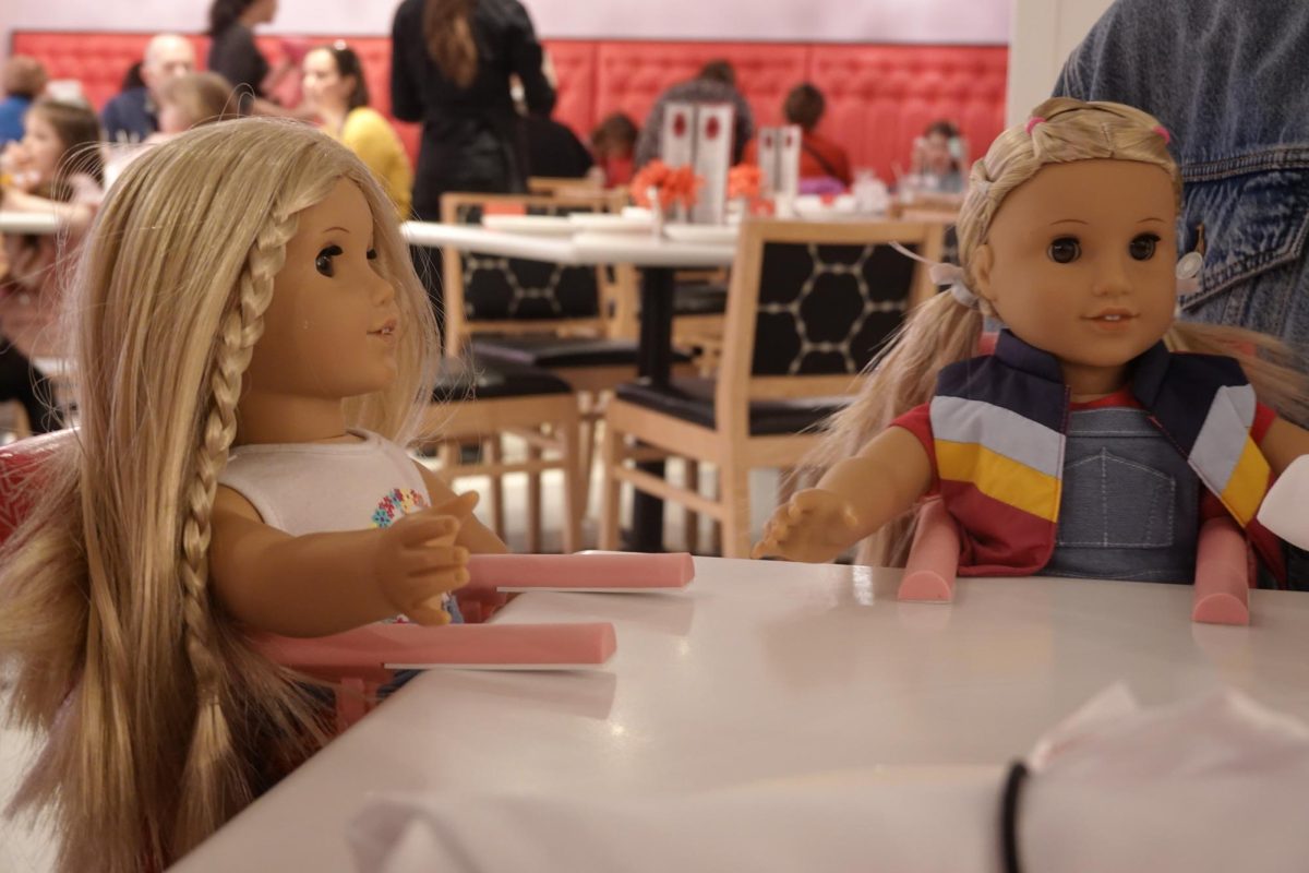 Julie and Julie are ready to share their first course at the American Girl Doll Cafe.