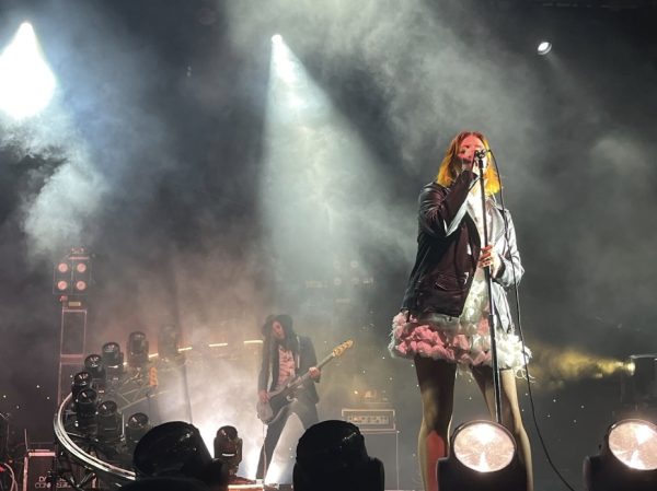 Abigail Kelly, backup vocalist for Dashboard Confessional, with Scott Schoenbeck playing the bass in the back.