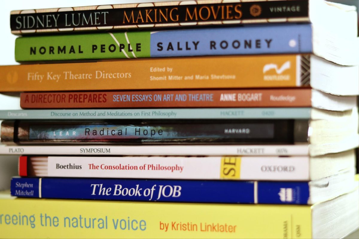 A student’s assigned books for the Fall 2024 semester stack up.
