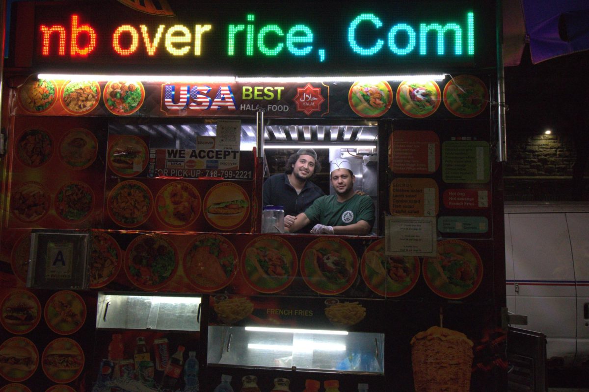 Ayman Moustafa, left, is recovering well after he was stabbed while working at the halal cart on West 60th Street. 