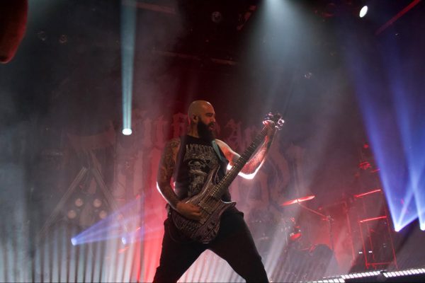 Peter Spinazola, the bassist for Fit For An Autopsy, plays thundering riffs during the show.