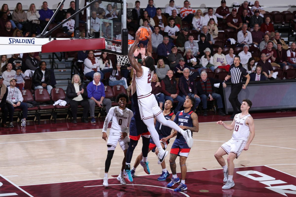 Junior guard Romand Dean drives it to the hole against the Dukes.