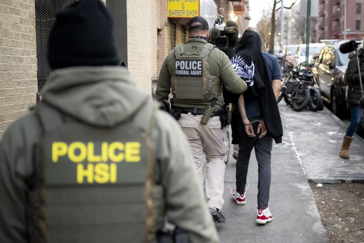 Homeland Security Investigations, HSI, agents conduct an arrest during an operation.  